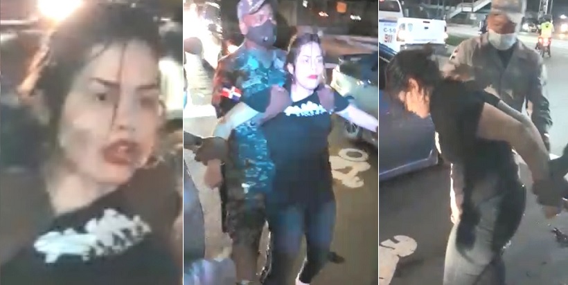 Mujer desafío a la policía en el toque de queda en Santo Domingo