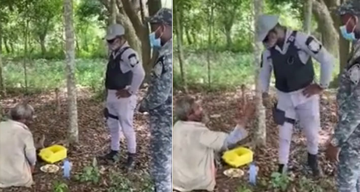 Policías le brindan un plato de comida a un indigente