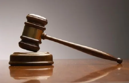 Dictan ocho meses de prisión preventiva a implicado en asalto a entidad financiera en Azua